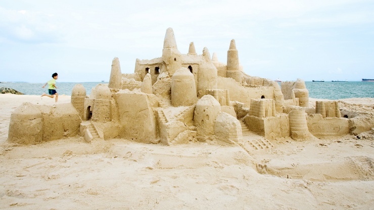 Elaborate sandcastle on the beach of East Coast Park on a sunny day in Singapore