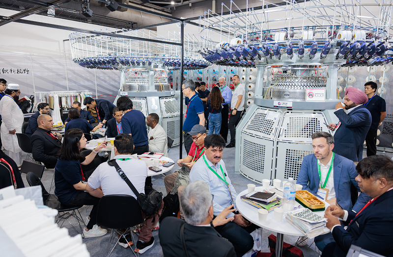 people seating in small tables, having a discussion within a booth