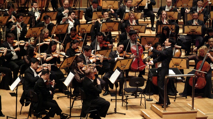 An orchestra performance at The Victoria Theatre and Concert Hall