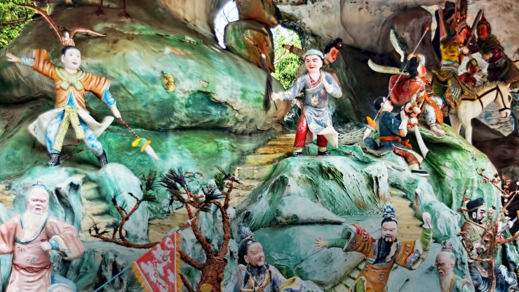 Close up of painted statues in Haw Par Villa 