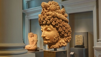 Close up of a clay head sculpture on exhibition