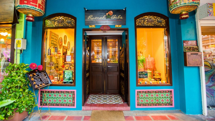The exterior of a vibrantly-adorned shophouse boutique