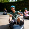 People riding down on the luge