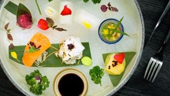 Vegetable sashimi on ice with quail egg shooter glass from Joie by Dozo