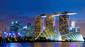 Night view of Marina Bay Sands, and Cloud Forest and Flower Dome conservatories, viewed from Marina Bay East Gardens