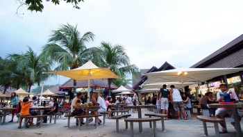 People eating at East Coast Lagoon Food Village.