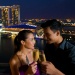 Couple with glasses of champagne with Marina Bay Sands and Art Science Museum in background