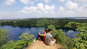 A couple enjoying the view at the peak of Puaka hill Pulau Ubin