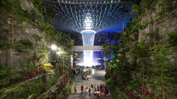 Evening View of the Shisedo Forest Valley & HSBC Rain Vortex at Jewel at Changi Airport the world's tallest indoor waterfall, surrounded by over 120 species of plants in a climate controlled dome designed by architect Moshe Safdie