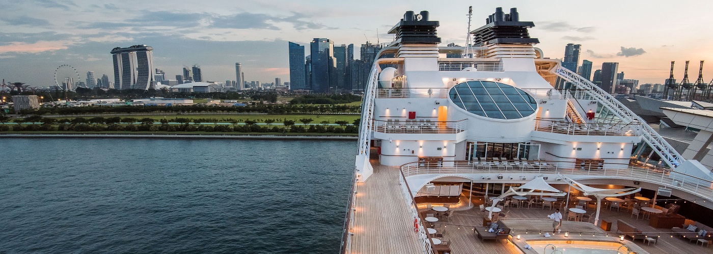 Top deck of a cruise ship, with Marina Bay Sands® in the background 