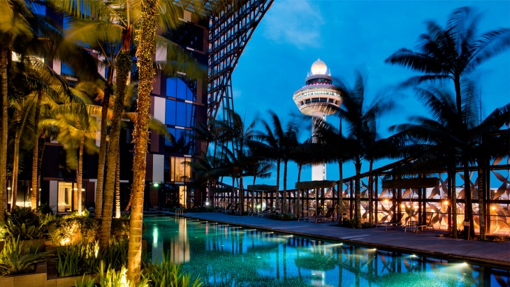 View from Crown Plaza Changi Airport’s pool overlooking Changi Airport control tower