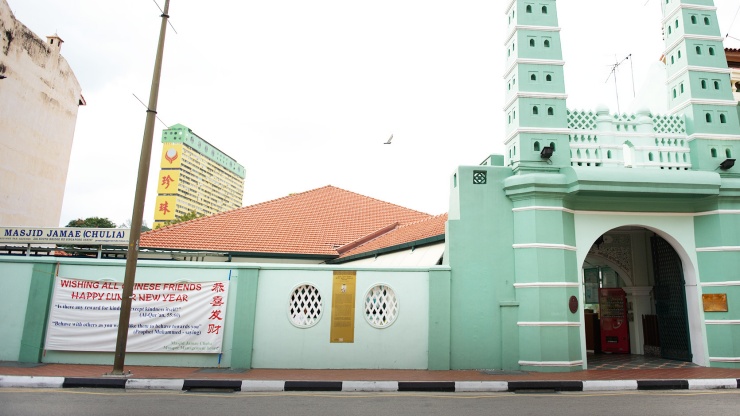 The iconic pastel green exterior of Masjid Jamae